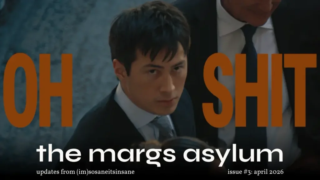 Close-up of Shane Hollander in a suit looking up intensely with bold orange “OH SHIT” text, used as the header image for “the margs asylum” April 2026 newsletter.